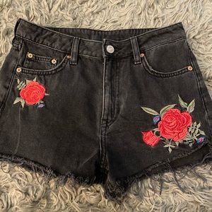 Black floral jean shorts